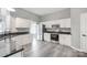 Bright kitchen features white cabinetry, stainless steel appliances, and dark countertops at 1107 Franklin Thomas Pl, Charlotte, NC 28214