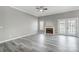 Spacious living room featuring wood-look floors, fireplace, and French doors at 1107 Franklin Thomas Pl, Charlotte, NC 28214