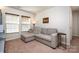 Comfortable living room with neutral walls, plush carpeting and natural light at 112 Abersham Dr, Mooresville, NC 28115