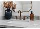 Stylish powder room boasting a marble countertop, decorative mirror, and bronze faucet at 11708 Huxley Rd, Charlotte, NC 28277