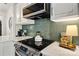 Stylish kitchen featuring a sleek cooktop and modern backsplash at 11708 Huxley Rd, Charlotte, NC 28277