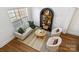 Cozy living room with an area rug and lots of natural light at 11708 Huxley Rd, Charlotte, NC 28277