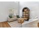 Inviting living room with a high ceiling, neutral-toned furniture, and natural light from a large window at 11708 Huxley Rd, Charlotte, NC 28277