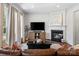 Cozy living room featuring a fireplace and stylish decor at 11708 Huxley Rd, Charlotte, NC 28277