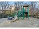 Community playground with slide, climbing structure, and a protective surface at 11708 Huxley Rd, Charlotte, NC 28277