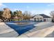 Community pool with a pool house and trees at 11708 Huxley Rd, Charlotte, NC 28277