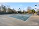 Outdoor tennis court with lights in a well-maintained community at 11708 Huxley Rd, Charlotte, NC 28277