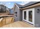 New home featuring an expansive back deck with white framed glass doors perfect for entertaining at 130A Springway Dr, Kannapolis, NC 28081