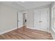 Bright bedroom with hardwood floors and white trim on doors and window at 130A Springway Dr, Kannapolis, NC 28081