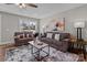 Inviting living room featuring neutral tones, modern decor, and a stylish area rug at 130A Springway Dr, Kannapolis, NC 28081