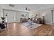 Well-lit living room with hardwood floors, a decorative rug, and comfortable seating at 130A Springway Dr, Kannapolis, NC 28081