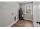 The utility room has wood-look floors and a window to the backyard at 130A Springway Dr, Kannapolis, NC 28081