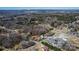 An aerial view shows a rural neighborhood with single-Gathering homes surrounded by trees, near the Catawba River Dam at 133 Sutton S Rd, Fort Mill, SC 29708