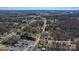 An aerial view shows a residential area, with single-Gathering homes nestled amongst trees, near I-77 at 133 Sutton S Rd, Fort Mill, SC 29708