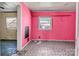 A pink bedroom featuring geometric flooring and a view into a hallway at 133 Sutton S Rd, Fort Mill, SC 29708