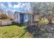 Exterior view of a home showcasing blue siding and a storage shed in the backyard at 133 Sutton S Rd, Fort Mill, SC 29708