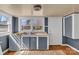 Functional kitchen space featuring blue cabinets, white countertops, and a double basin sink at 133 Sutton S Rd, Fort Mill, SC 29708