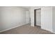 Bedroom featuring a closet, neutral walls, carpet, and a door to another room at 13923 Singleleaf Ln, Charlotte, NC 28278