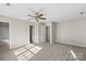 The bedroom features neutral walls, carpet, and two closets at 13923 Singleleaf Ln, Charlotte, NC 28278