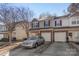 Charming townhome featuring a brick-accented facade, attached garage, and manicured landscaping at 13923 Singleleaf Ln, Charlotte, NC 28278