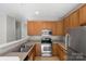 Functional kitchen featuring stainless steel appliances, ample cabinetry, and durable countertops at 13923 Singleleaf Ln, Charlotte, NC 28278