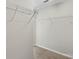 Walk-in closet features white wire shelving and neutral carpet at 13923 Singleleaf Ln, Charlotte, NC 28278