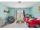 Playful bedroom with a gray chair, and a bed shaped like a red Jeep at 14621 Brannock Hills Dr, Charlotte, NC 28278