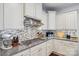 Modern kitchen featuring granite counters, stainless steel appliances, and tiled backsplash at 14621 Brannock Hills Dr, Charlotte, NC 28278