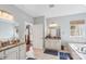 This main bathroom features a separate shower, granite vanity and a garden tub beneath a window at 14621 Brannock Hills Dr, Charlotte, NC 28278