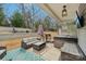 Relaxing covered patio area perfect for outdoor entertaining, complete with seating and a hot tub at 14621 Brannock Hills Dr, Charlotte, NC 28278