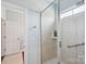 Modern bathroom features a shower with glass doors and tiled walls at 14621 Brannock Hills Dr, Charlotte, NC 28278