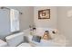 Bathroom with a soaking tub, white tile, and modern fixtures at 1474 Callender Nw Ln, Charlotte, NC 28269