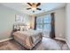 Bedroom featuring a comfortable bed, neutral paint, and ample natural light at 1474 Callender Nw Ln, Charlotte, NC 28269