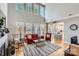 Inviting living room featuring a fireplace, hardwood floors, and a view of the modern kitchen at 1474 Callender Nw Ln, Charlotte, NC 28269