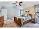 Comfortable main bedroom with a ceiling fan, and neutral colors at 1474 Callender Nw Ln, Charlotte, NC 28269