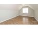 Bonus room boasting hardwood floors and a window offering natural light at 1512 Pecan Ave, Charlotte, NC 28205