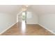 Bonus room showcasing an exterior exit, hardwood floors and ample lighting at 1512 Pecan Ave, Charlotte, NC 28205