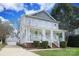 Charming two-story home with a welcoming front porch and well-manicured lawn at 1512 Pecan Ave, Charlotte, NC 28205