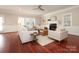 Cozy living room featuring a fireplace, plush seating, and natural light at 1512 Pecan Ave, Charlotte, NC 28205