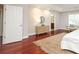 Bright main bedroom boasting a view of the ensuite bathroom and hardwood floors at 1512 Pecan Ave, Charlotte, NC 28205