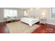 Spacious main bedroom with large windows, a sitting area and a king bed at 1512 Pecan Ave, Charlotte, NC 28205