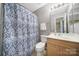 Bathroom with a gray wall, patterned shower curtain, and light-colored vanity at 1559 Maypine Commons Way, Rock Hill, SC 29732