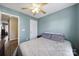 Bedroom with pale blue walls, hardwood floors, and a ceiling fan at 1559 Maypine Commons Way, Rock Hill, SC 29732