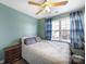 Bedroom with pale green walls, hardwood floors, and a ceiling fan at 1559 Maypine Commons Way, Rock Hill, SC 29732