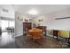 Bright dining room with wood floors, ideal for Gathering meals, offers a view of the outdoor patio at 1559 Maypine Commons Way, Rock Hill, SC 29732