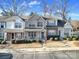 Front exterior of a townhome featuring manicured landscaping and a parking lot at 1559 Maypine Commons Way, Rock Hill, SC 29732