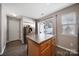 This space has a breakfast bar island in the kitchen with neutral walls and wood-look flooring at 1559 Maypine Commons Way, Rock Hill, SC 29732