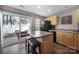 Efficient kitchen with island, dark appliances and a sliding door leading to the back patio at 1559 Maypine Commons Way, Rock Hill, SC 29732