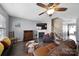 Bright living room featuring a fireplace, and a ceiling fan, creating an inviting space at 1559 Maypine Commons Way, Rock Hill, SC 29732