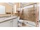 Bathroom with granite countertop, tile backsplash, glass-enclosed shower, and neutral color palette at 16023 Rushwick Dr, Huntersville, NC 28078